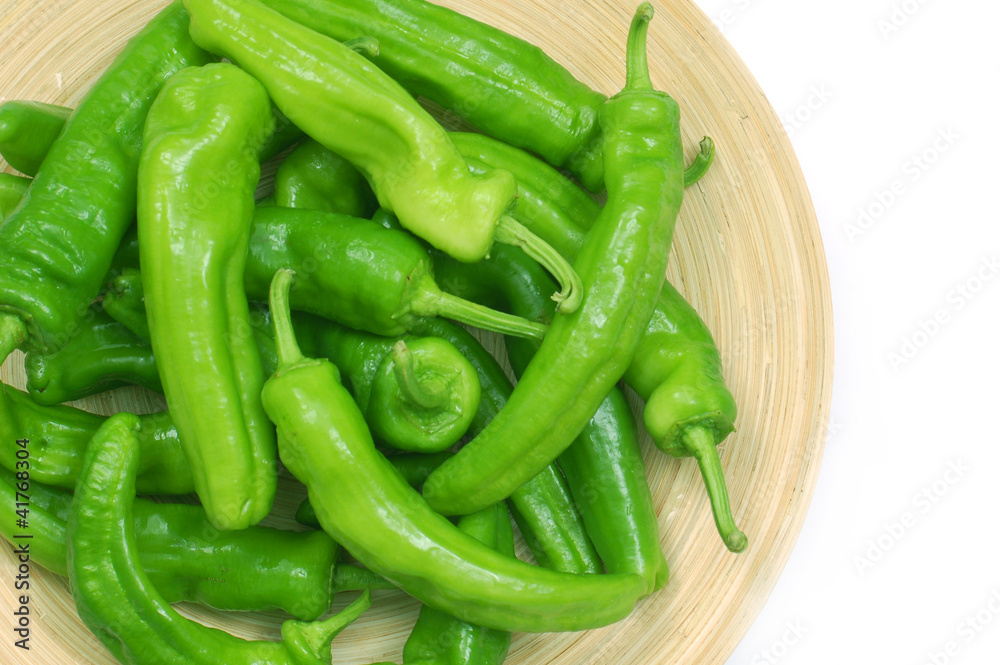 Green peppers in plate white background copy space. Green peppers in plate white background copy space.