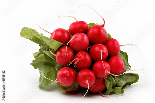 Healthy food. Bunch of fresh radishes on a white background.