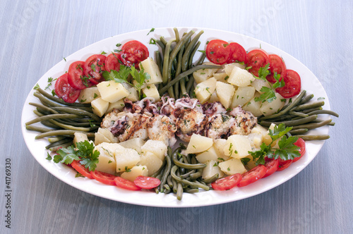 secon fish, squid stuffed with patatoes and vegetable photo