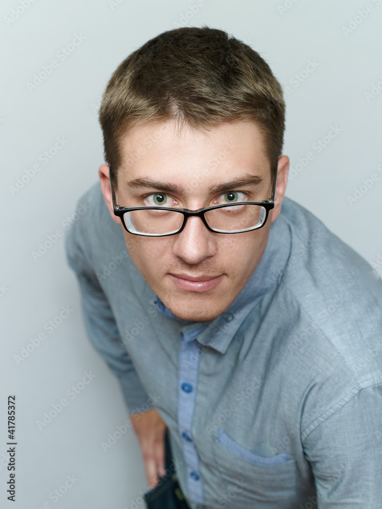 Portrait of the young white man in a hat on the head Portrait of the young white man in a hat on the head