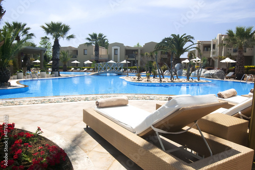 Swimming pool at beautiful vacation holiday resort complex photo