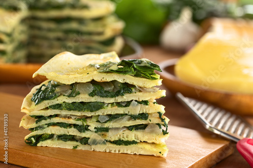 A piece of savory crepes layered with chard (mangold)
