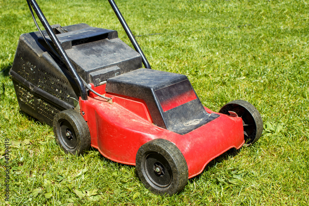 Lawnmower on grass Lawnmower on grass