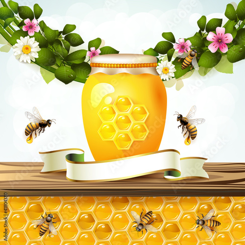 Glass jar and honey over floral background