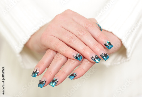 Female hands with blue manicure