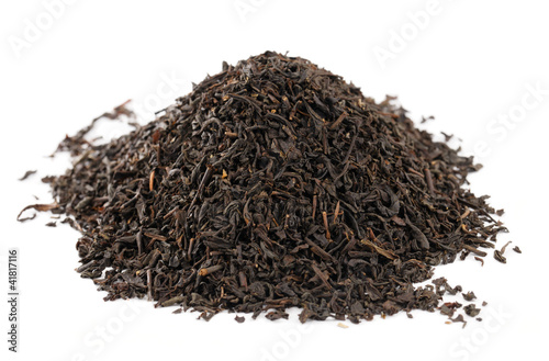 Earl Grey black loose tea leaves on white background, shallow d