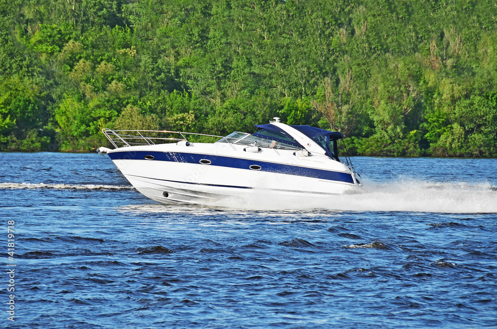 Fototapeta premium Motorboat on the Dnieper river, Kiev, Ukraine