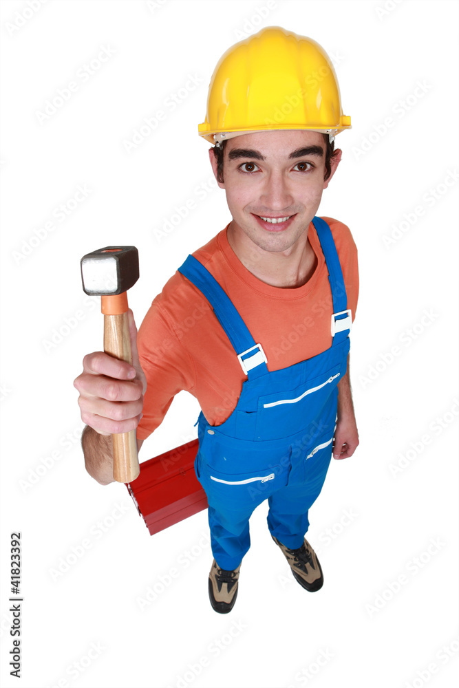 Worker holding lump hammer