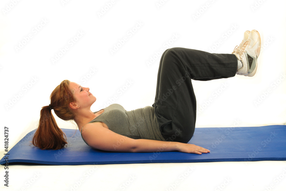 Fototapeta premium Frau auf Gymnastikmatte 6.12