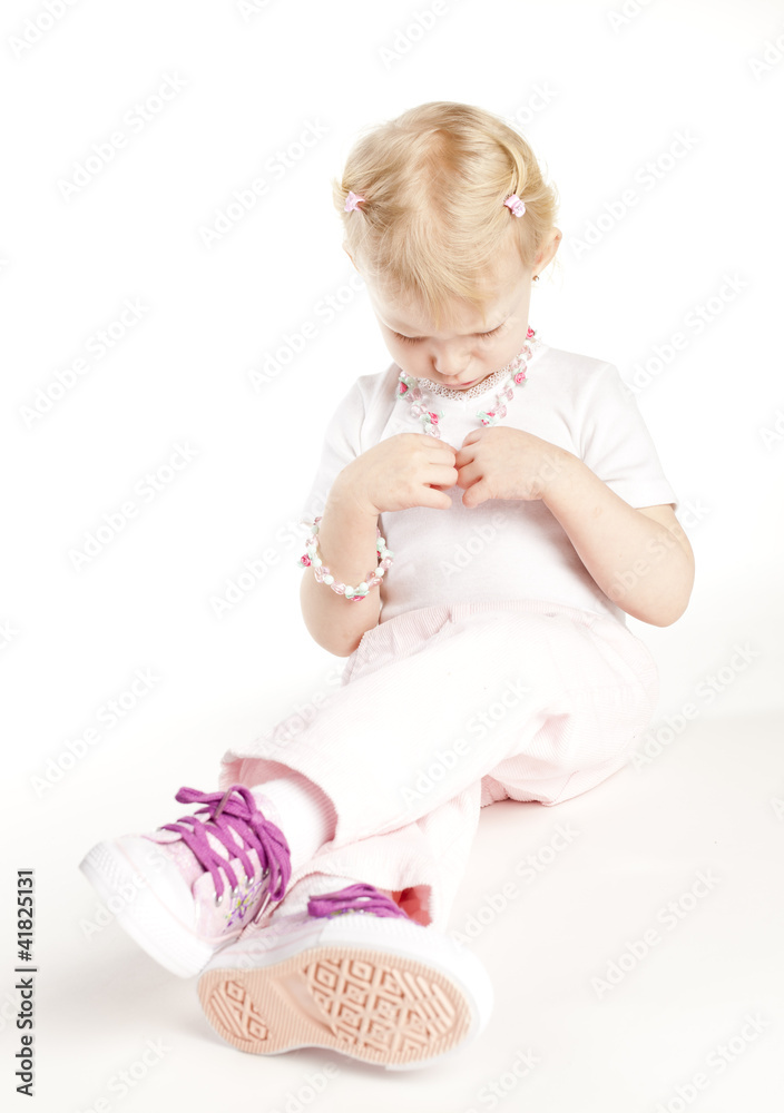 sitting little girl wearing necklace sitting little girl wearing necklace