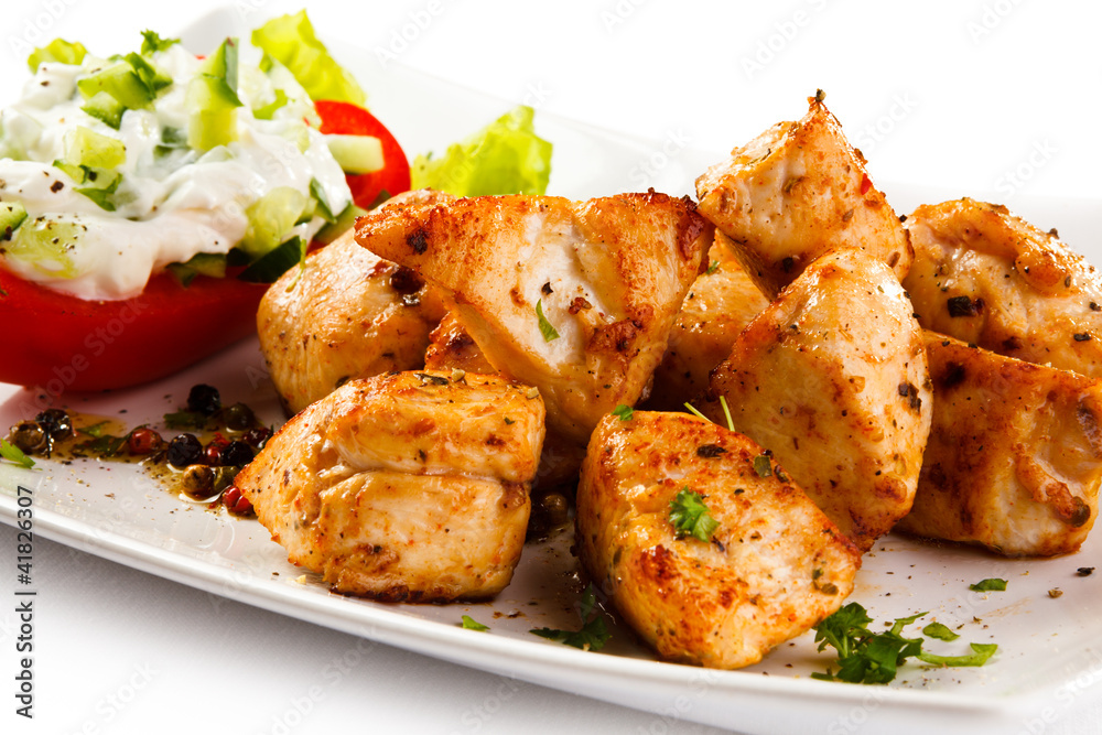 Grilled meat and vegetables on white background Grilled meat and vegetables on white background