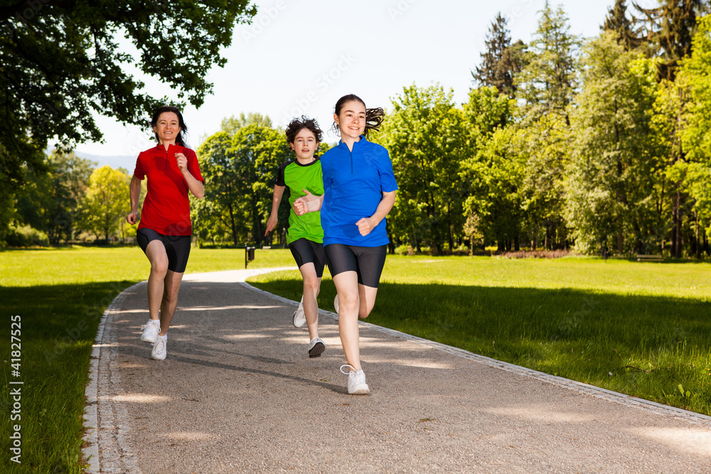 Fototapeta premium Active family - mother and kids running outdoor