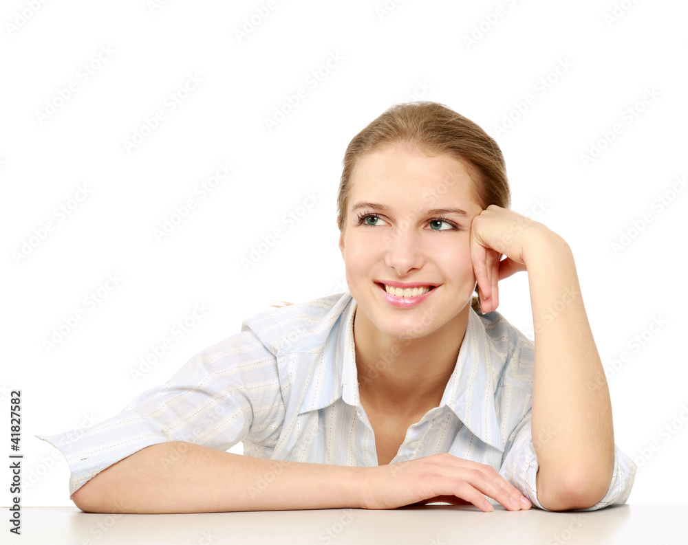 A businesswoman sitting at the desk, isolated on white A businesswoman sitting at the desk, isolated on white