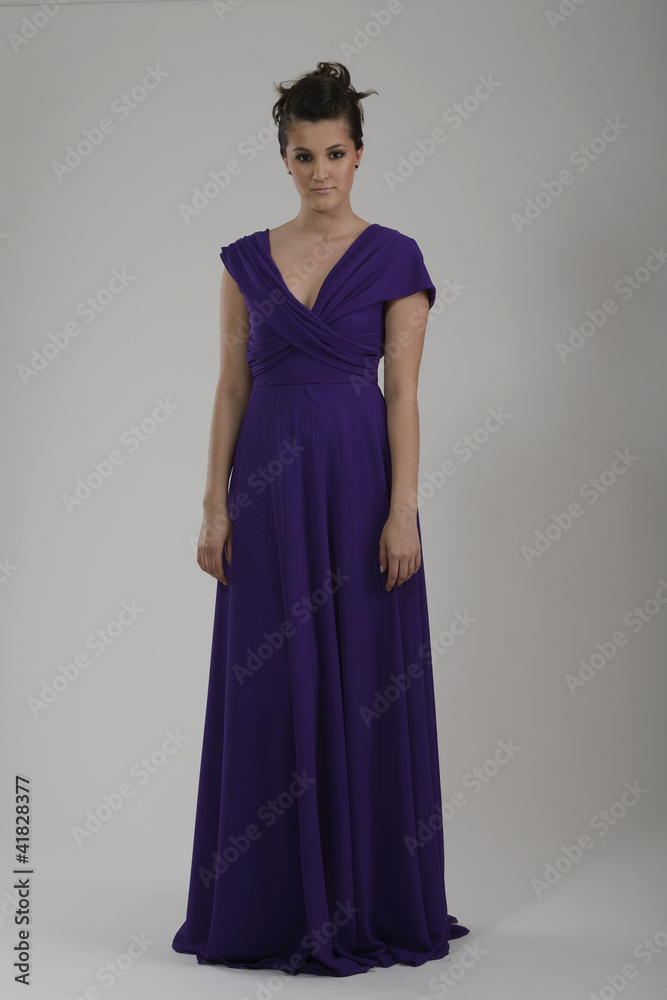 elegant woman in fashionable dress posing in the studio elegant woman in fashionable dress posing in the studio