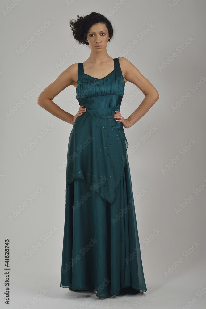 elegant woman in fashionable dress posing in the studio elegant woman in fashionable dress posing in the studio