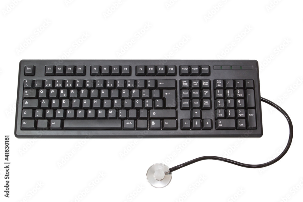 The keyboard for the computer and stethoscope. On a white backgr The keyboard for the computer and stethoscope. On a white backgr