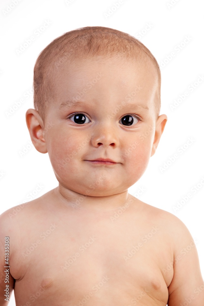 Portrait of a smiling one-year old boy over white