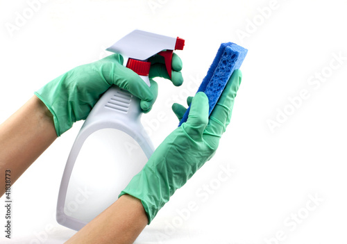 Gloved hands with sponge and cleaning spray