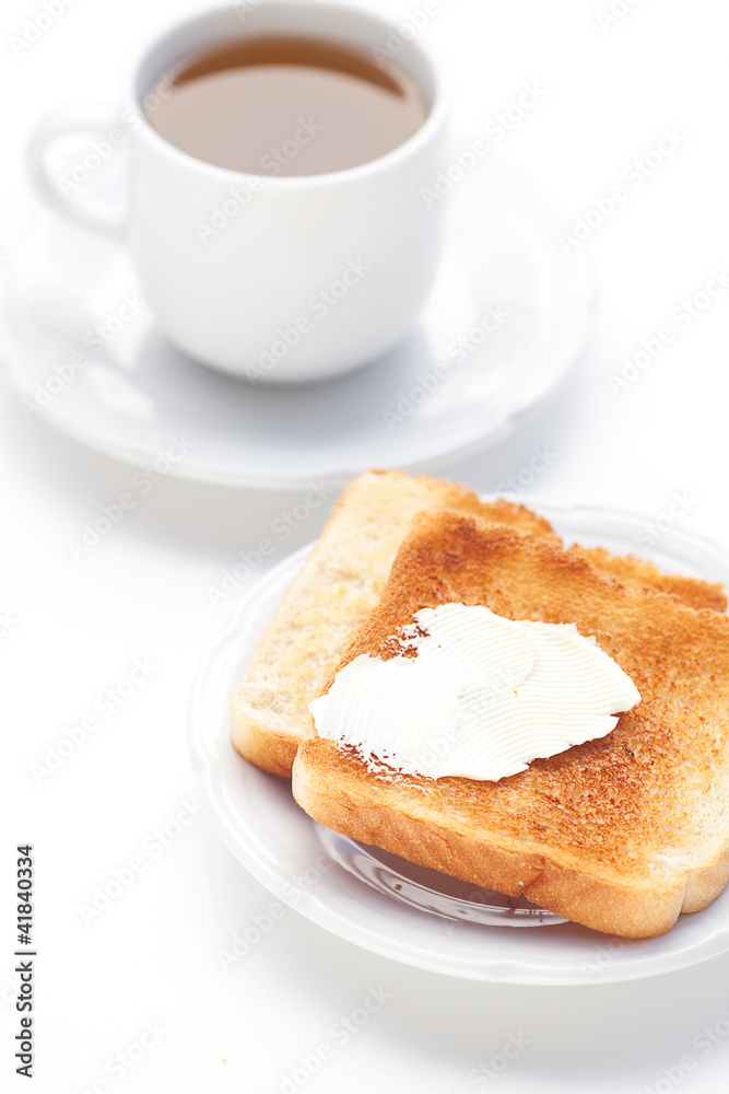 tea and toast with butter isolated on white tea and toast with butter isolated on white