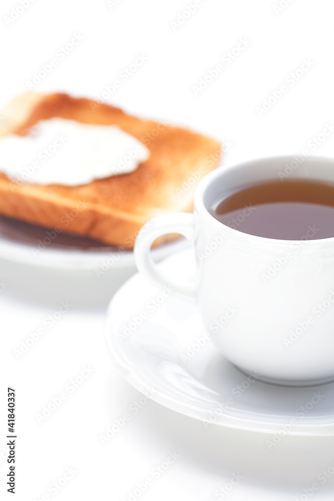 tea and toast with butter isolated on white tea and toast with butter isolated on white