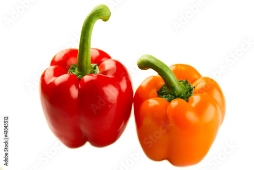 Red and orange pepper on white