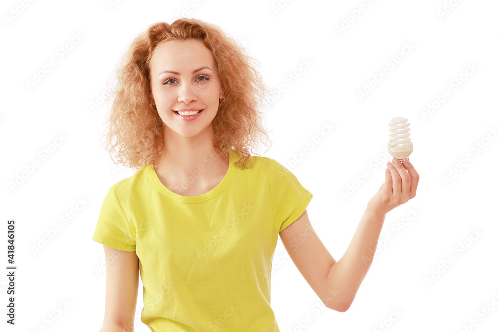 A woman with an energy-saving bulb in her hand A woman with an energy-saving bulb in her hand