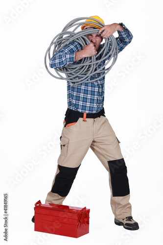 Artisan holding cable