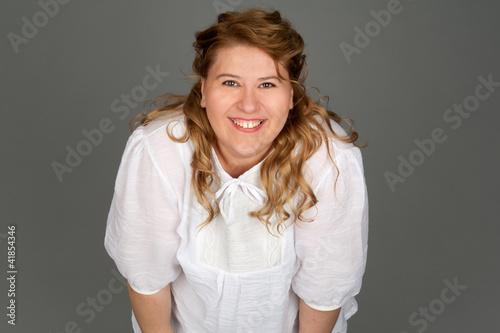 Quadro em tela smiling fat woman on gray background