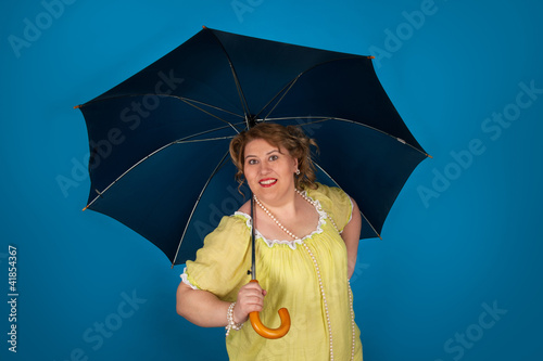 Fotografia Cute fat woman holding umbrella