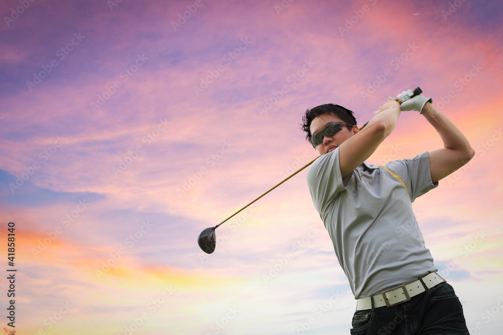 Golfer shooting a golf ball