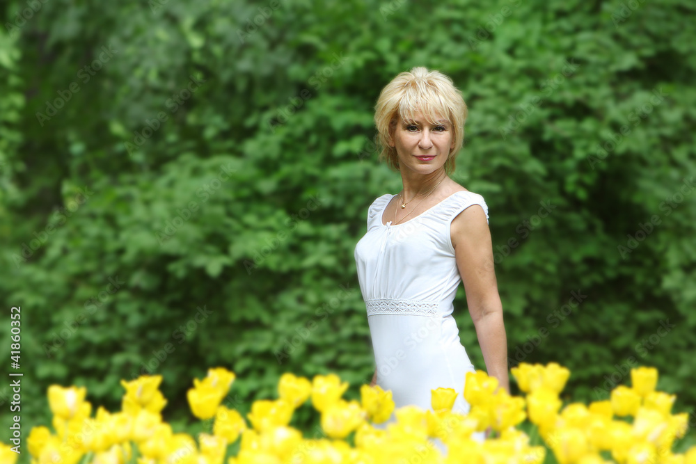 outdoor portrait of middle-aged woman on natural background