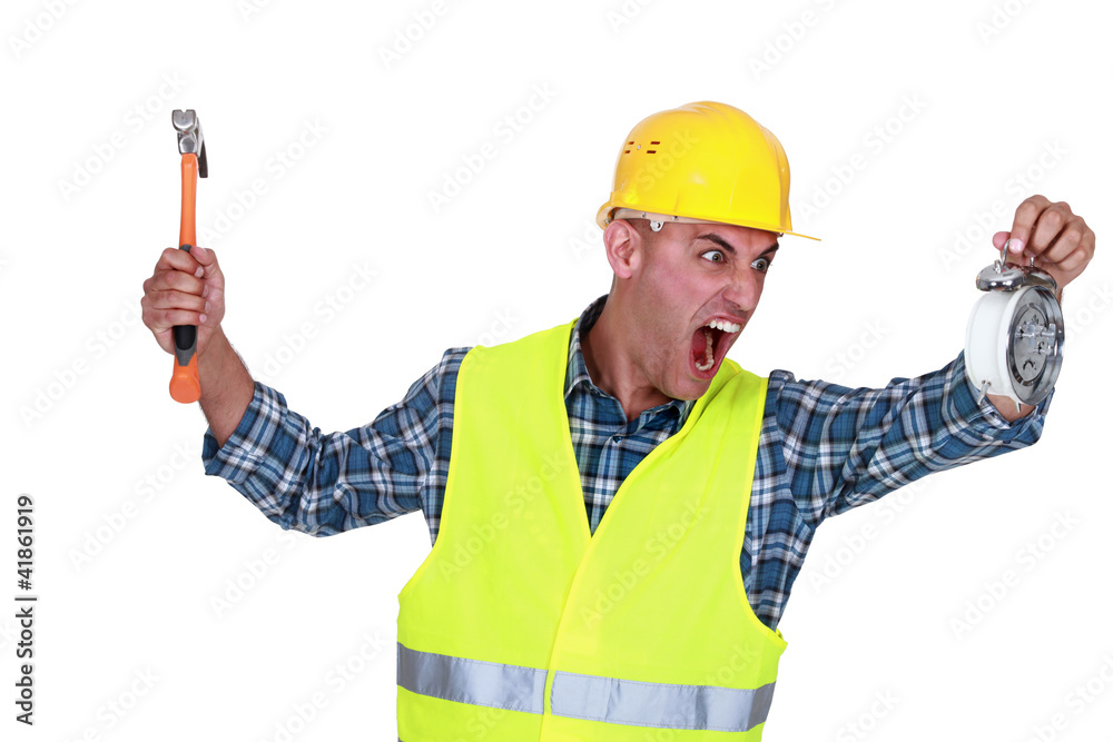 Angry tradesman looking at the time Angry tradesman looking at the time