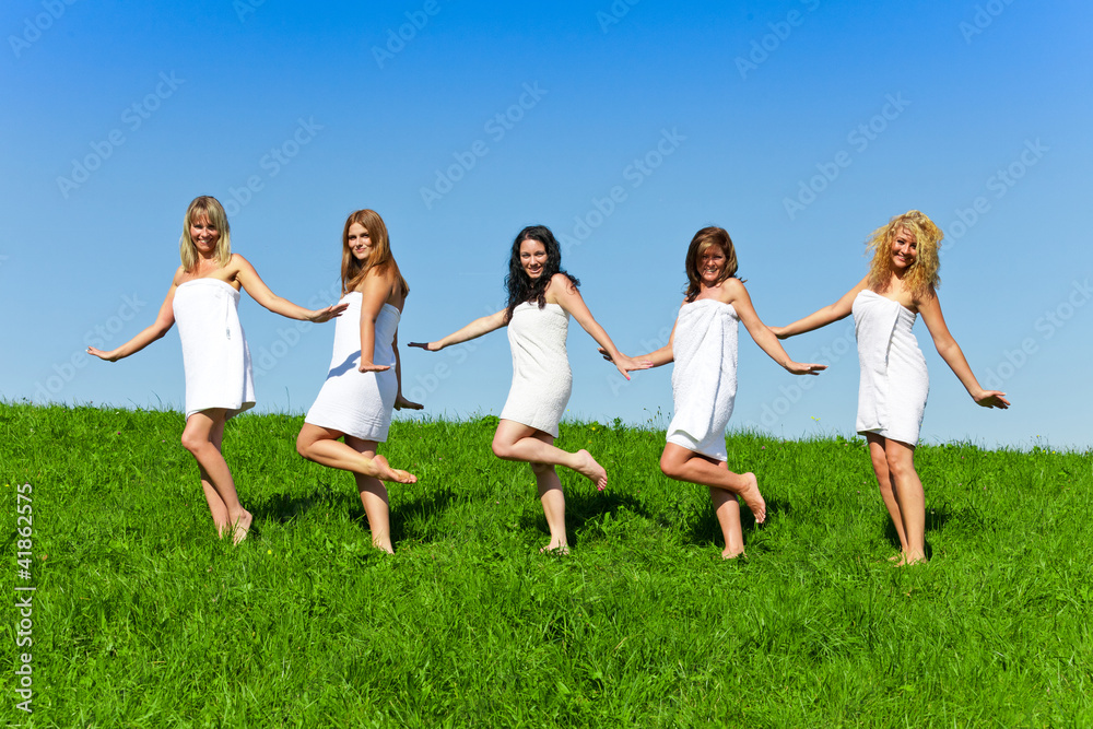 Women with towel on meadow