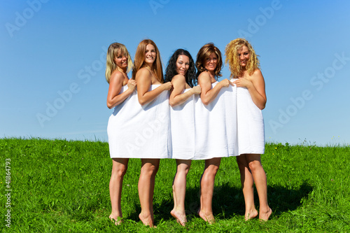 Women with towel on meadow