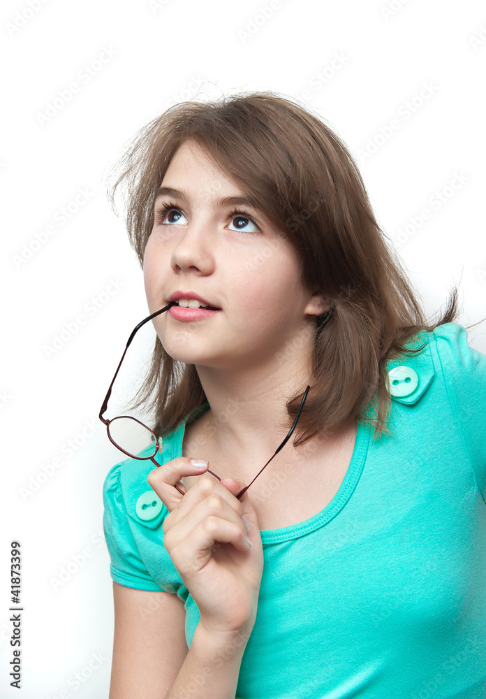 Attractive teenage girl deliberates a decision looking up Attractive teenage girl deliberates a decision looking up