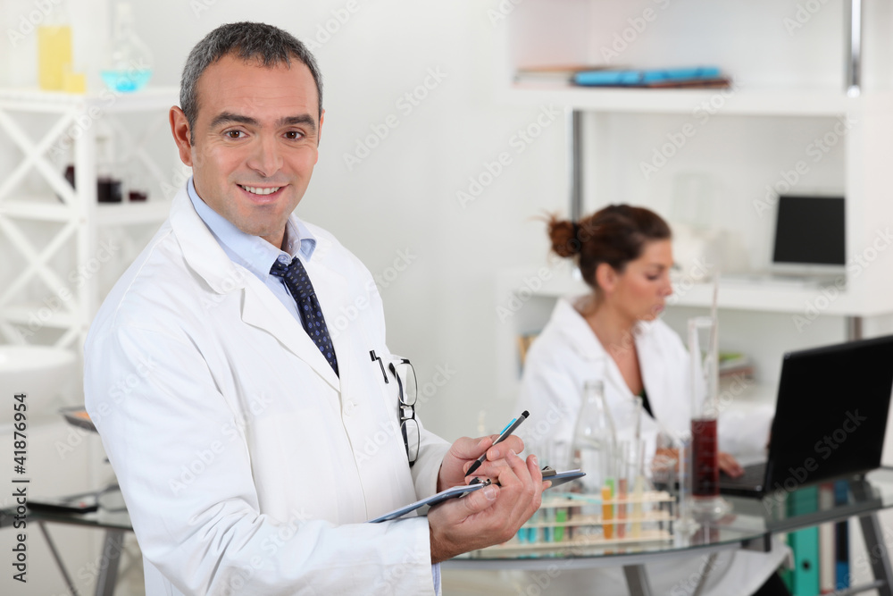 Two scientists working in laboratory Two scientists working in laboratory