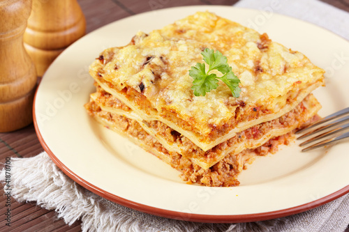 Italian cuisine. Meat lasagna on the served table