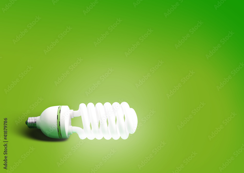 Compact fluorescent light bulb green background Compact fluorescent light bulb green background