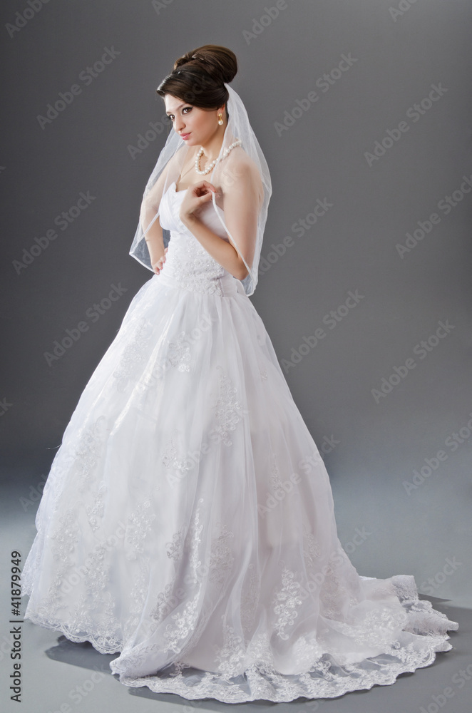 Fototapeta premium Bride in wedding dress in studio shooting