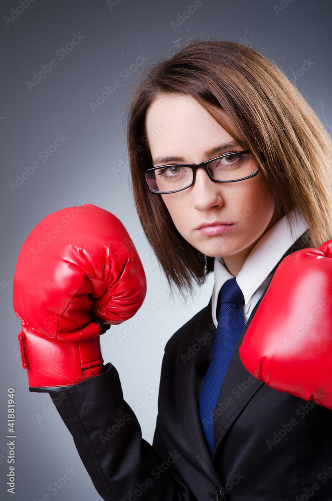 Young businesswoman in boxing concept Young businesswoman in boxing concept