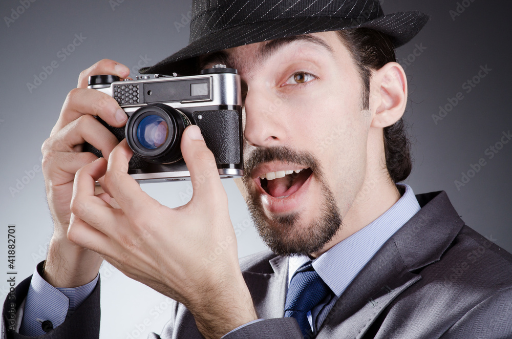 Fototapeta premium Photographer man with vintage camera