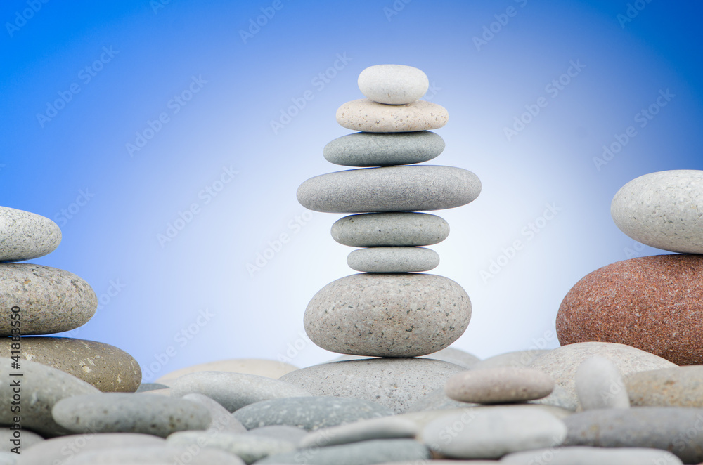 Pebbles stack against gradient background Pebbles stack against gradient background