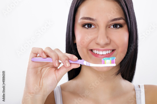 Beautiful Girl Brushing her teeth