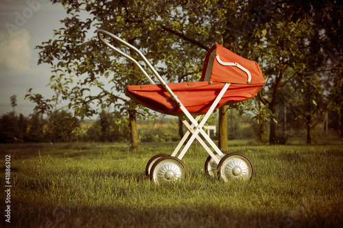 toy pram in orchard