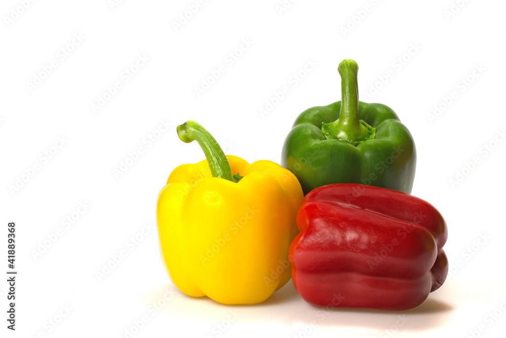 Green, red and yellow paprika (pepper) on a white background Green, red and yellow paprika (pepper) on a white background
