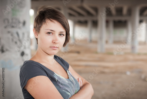 brunette posing in the industrial site