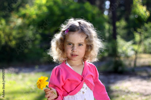 Lovely girl with a flower photo