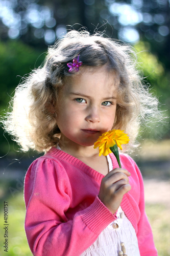 Lovely girl with a flower photo