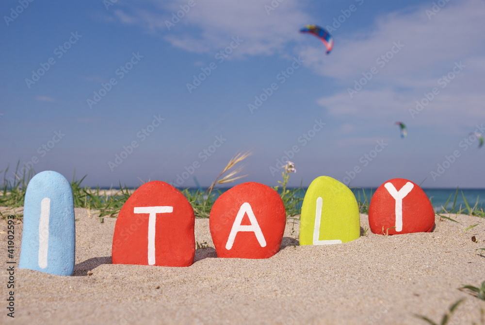 Italy on colourful stones with coast background