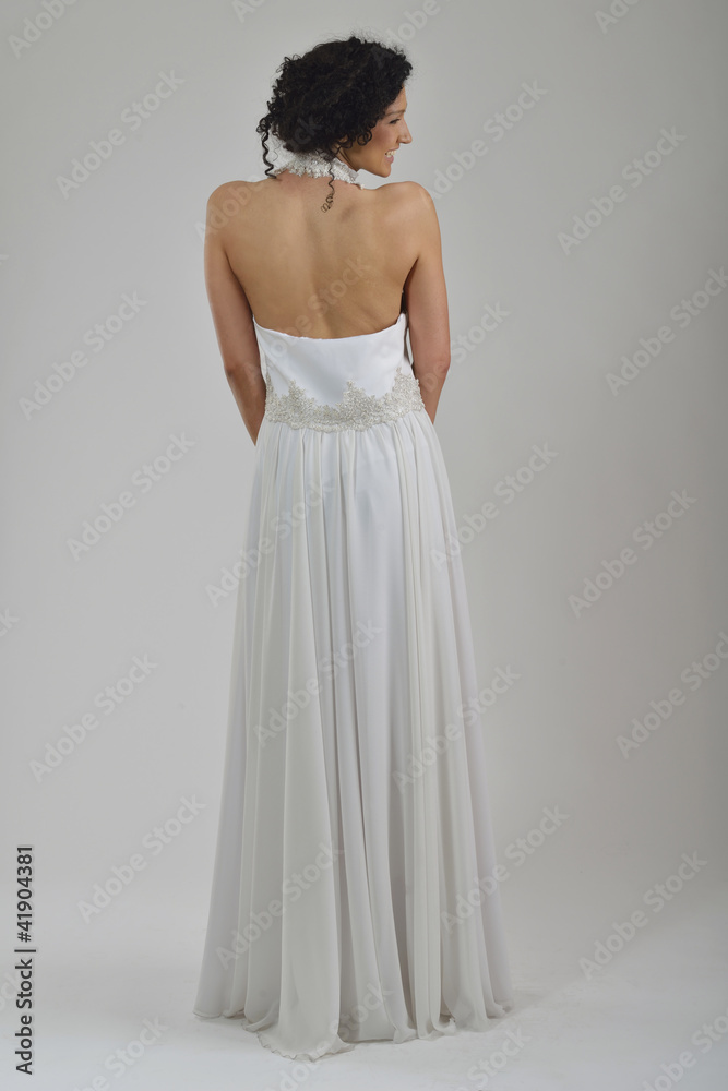 elegant woman in fashionable dress posing in the studio elegant woman in fashionable dress posing in the studio